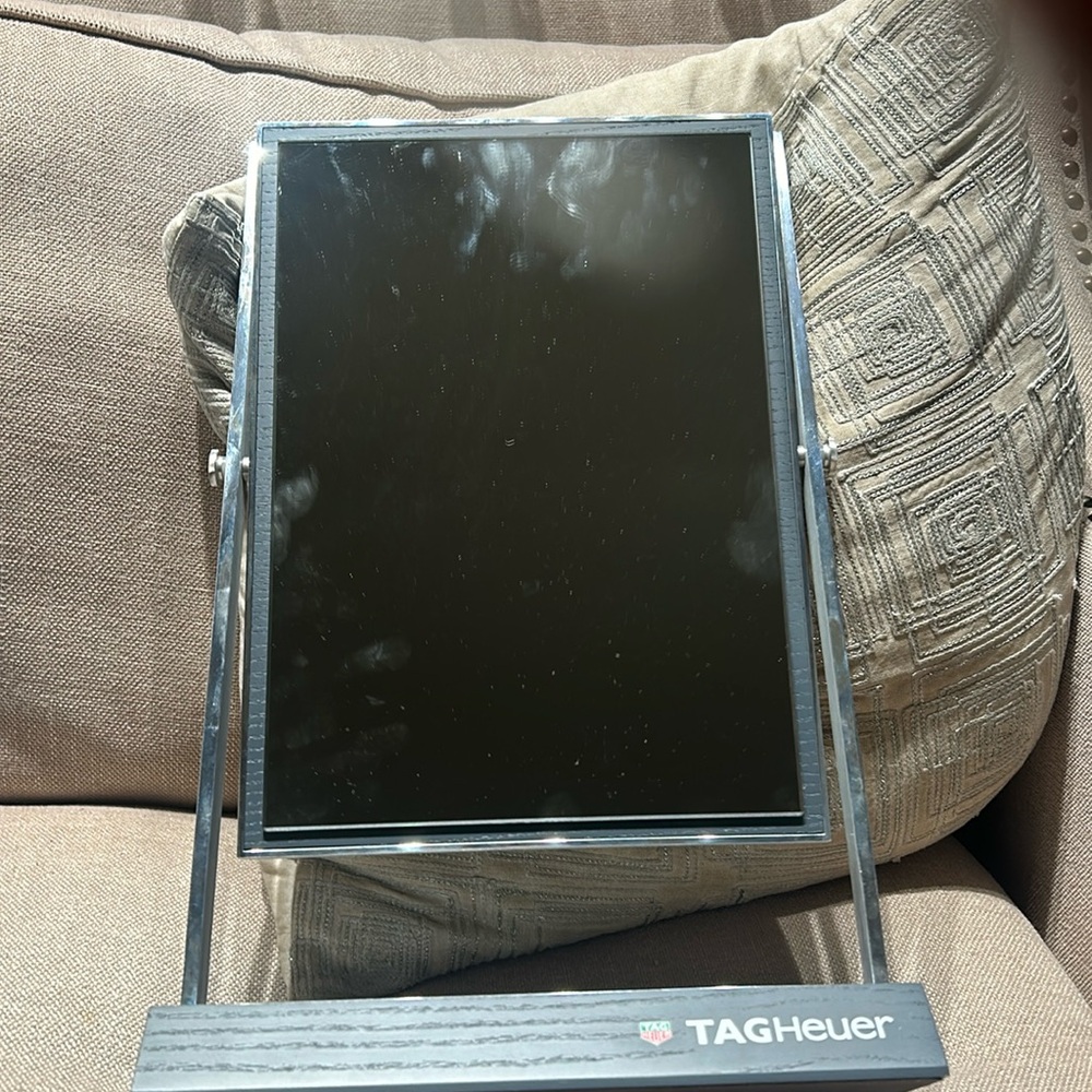 Tag Heuer double sided rotating mirror.